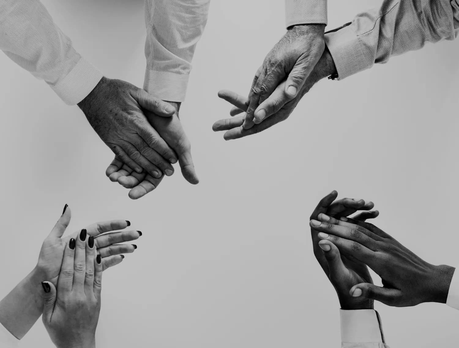People bringing their hands together in collaboration
